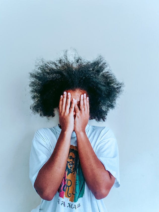 Woman who is sad because of a bad and matted hair day